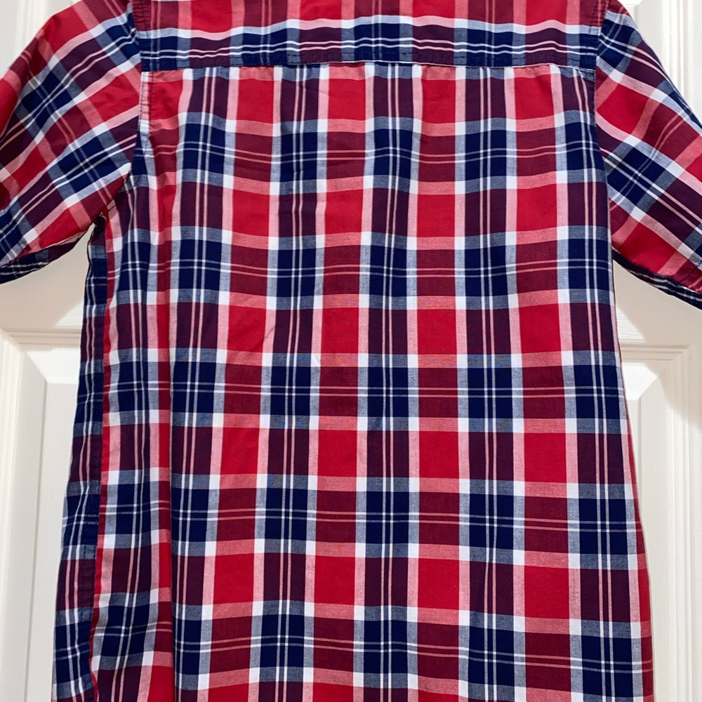 Button down young boys shirt.